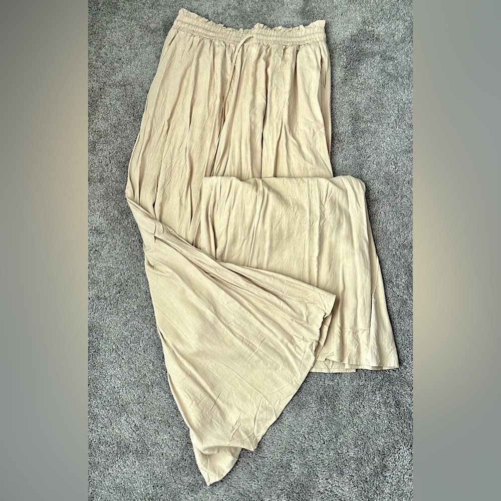 Cream trousers never worn.
